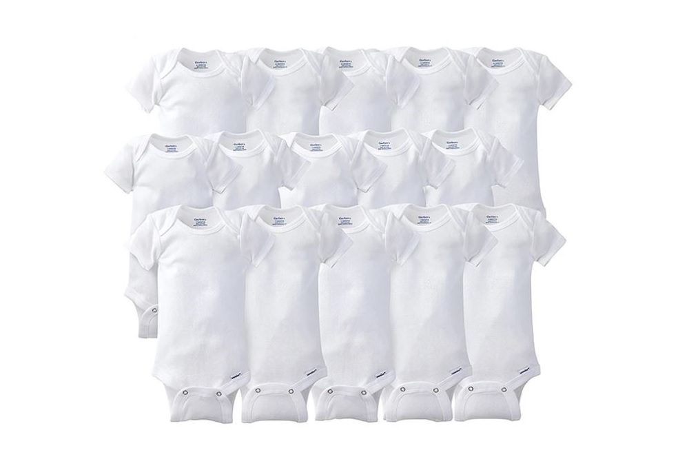 Rows of white baby onesies