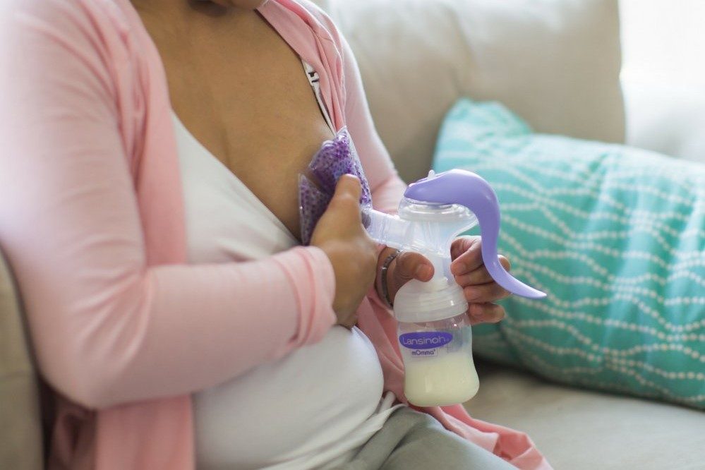 woman pumping breastmilk