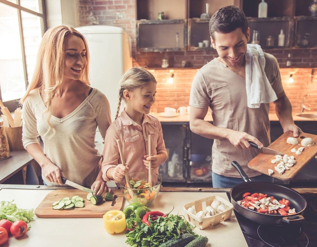 Family cooking together in the kitchen