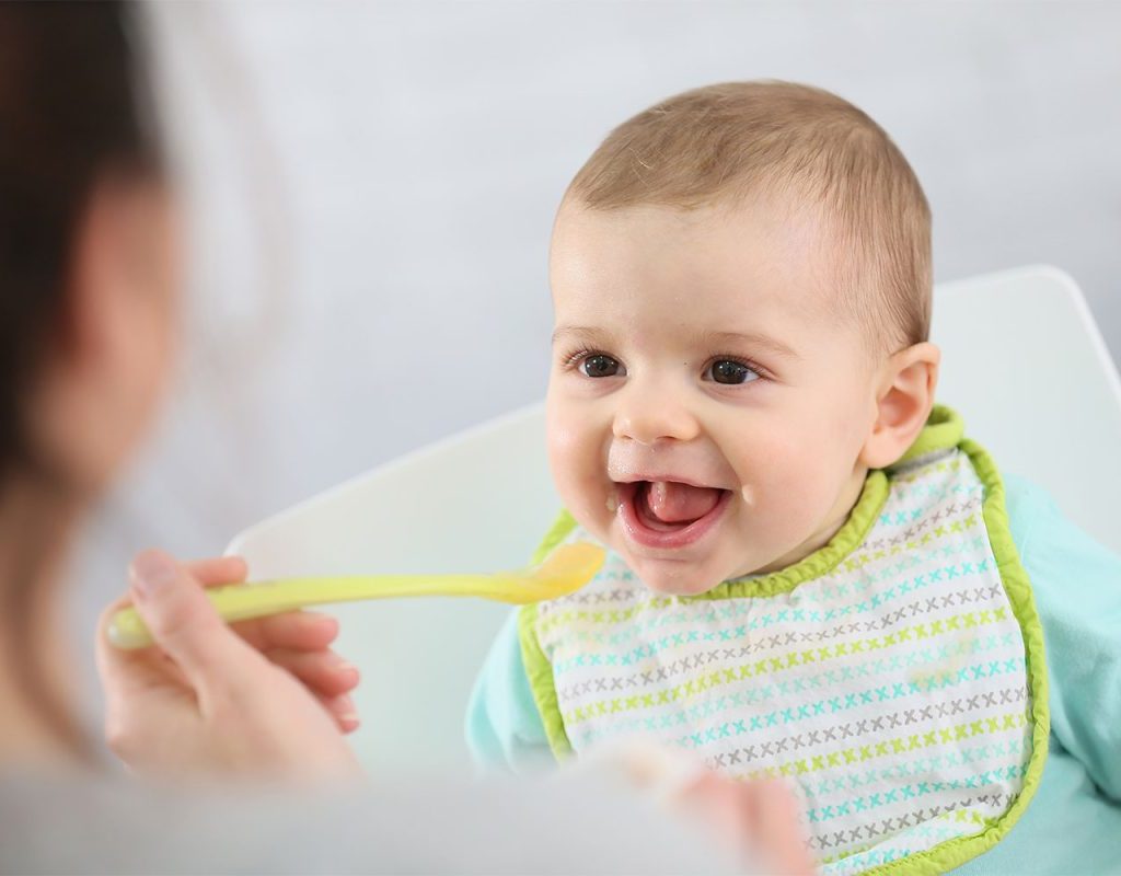 baby eating baby food