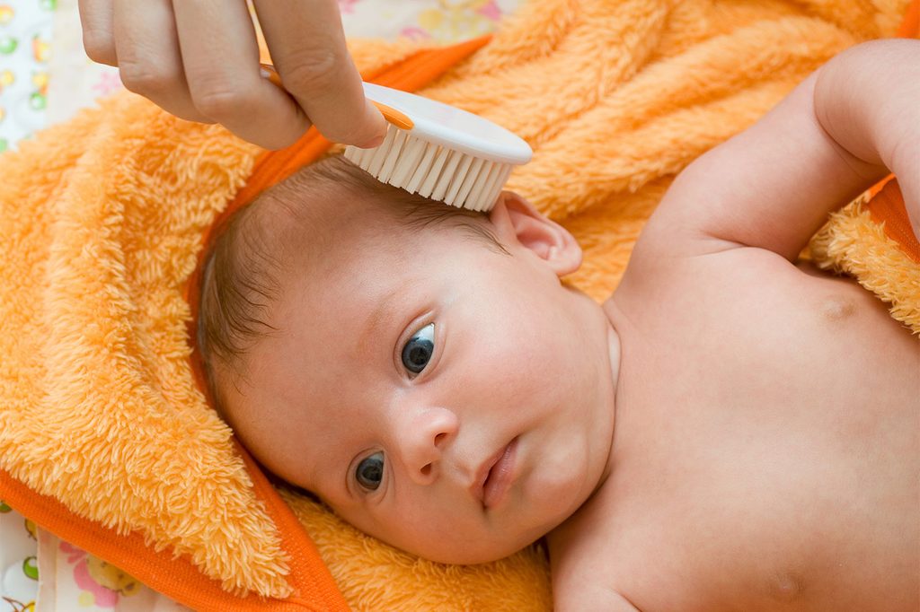 brushing baby hair
