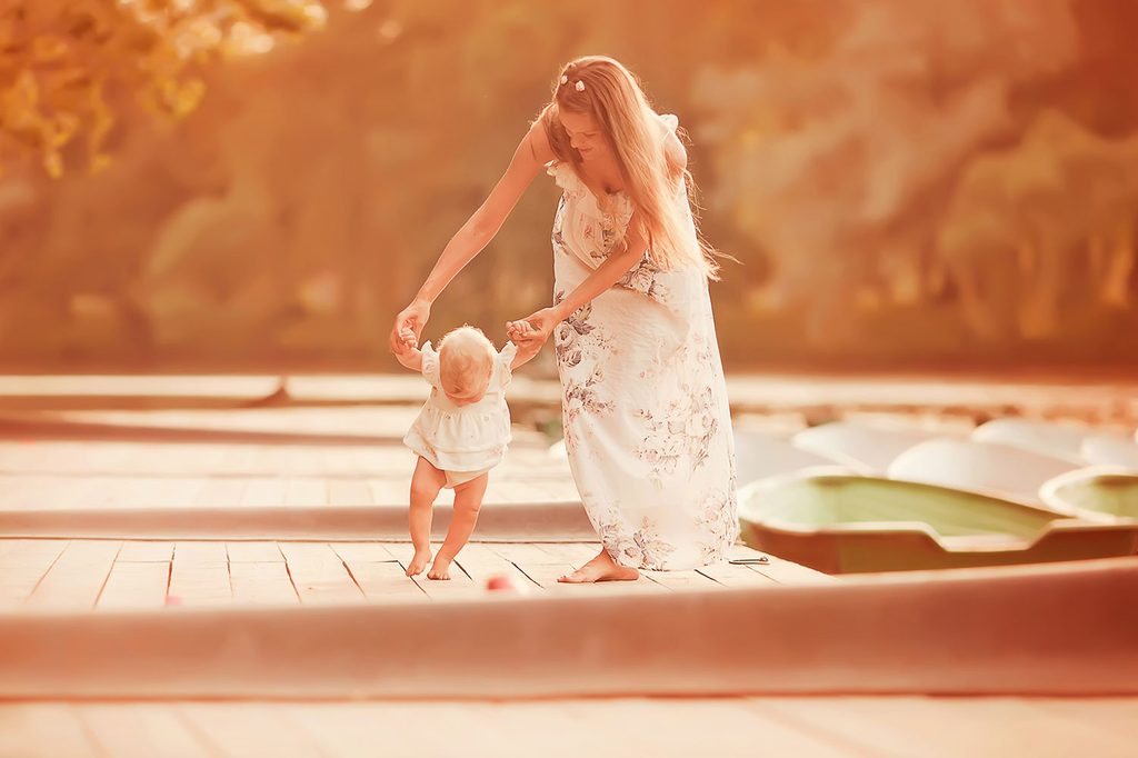Mother and baby walking milestone