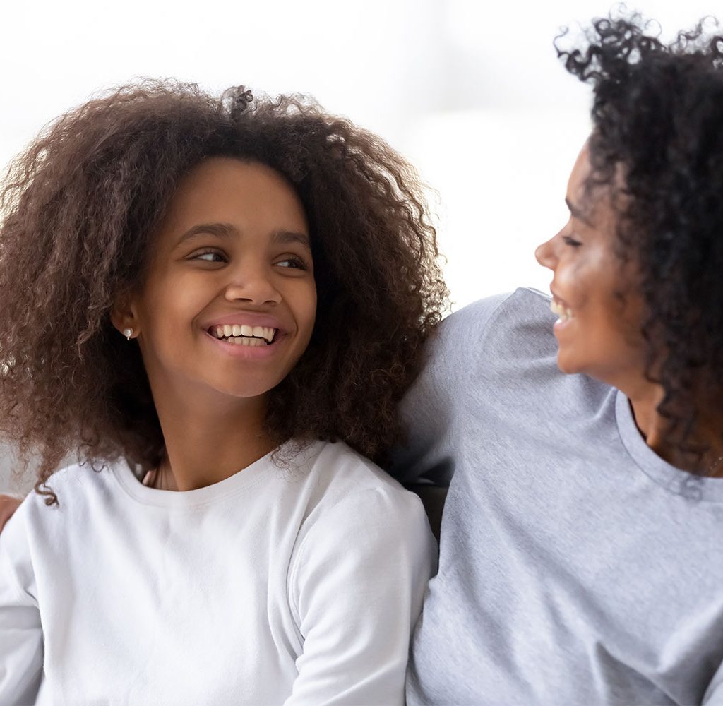 mother and daughter laughing