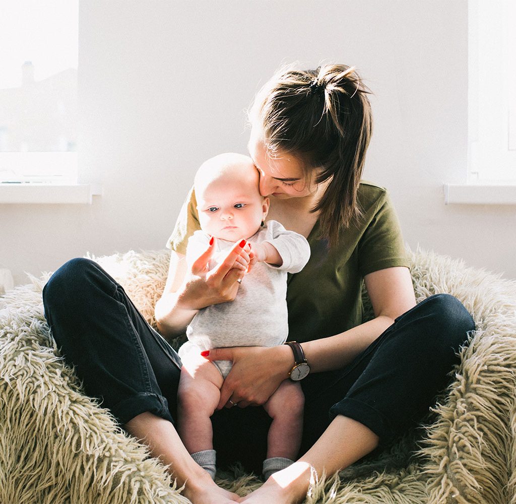 mother holding baby