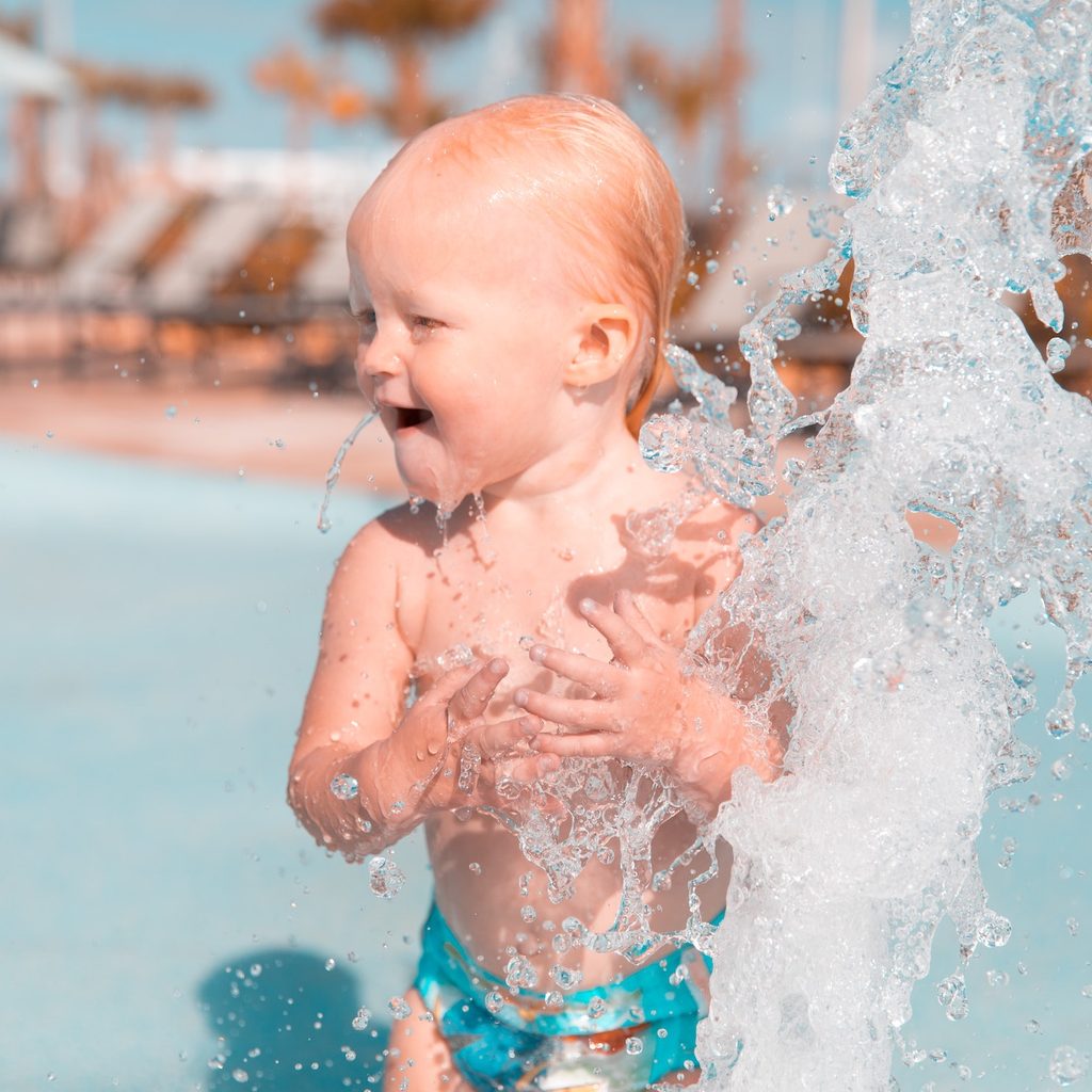 baby splashing in water