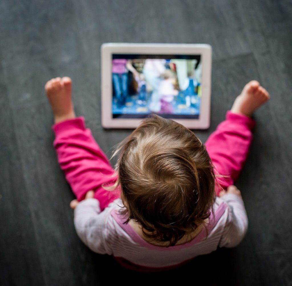 toddler on tablet