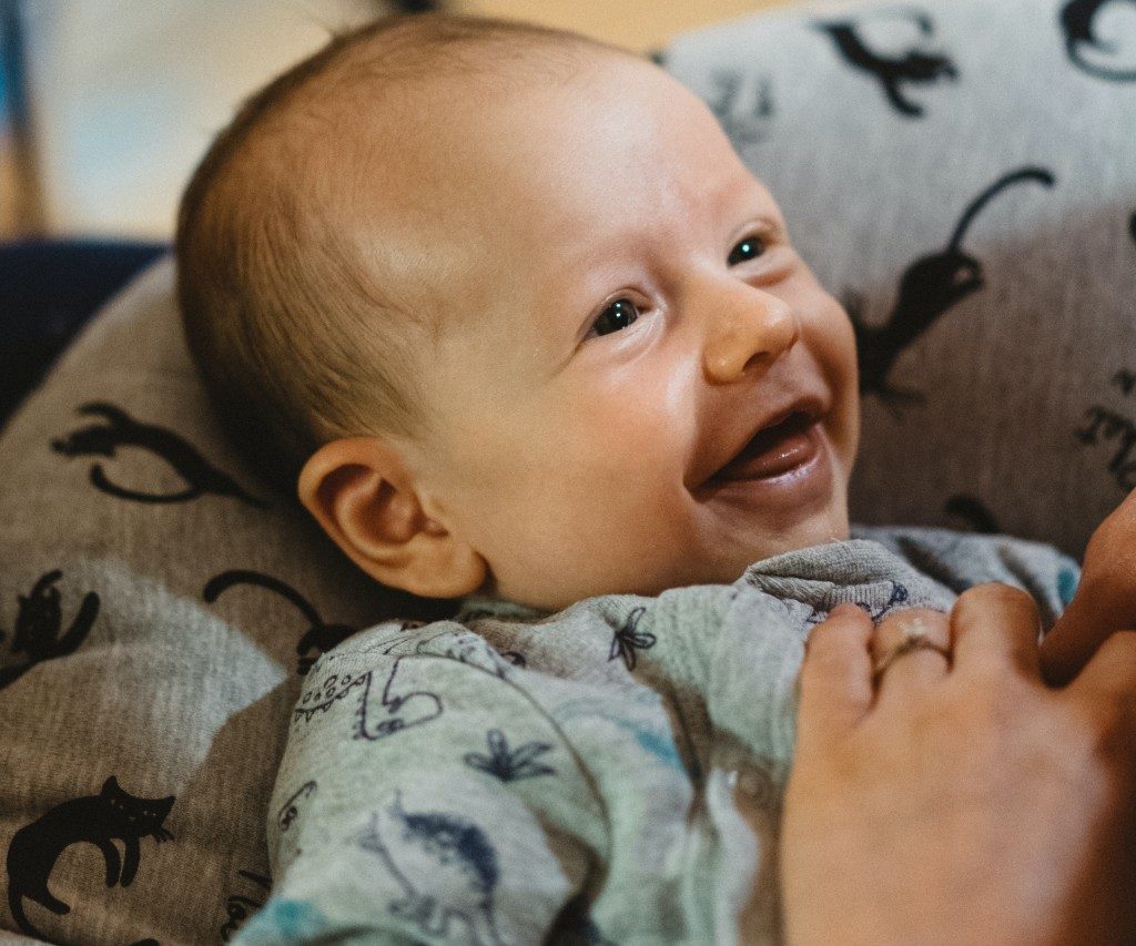 Smiling baby in pajamas