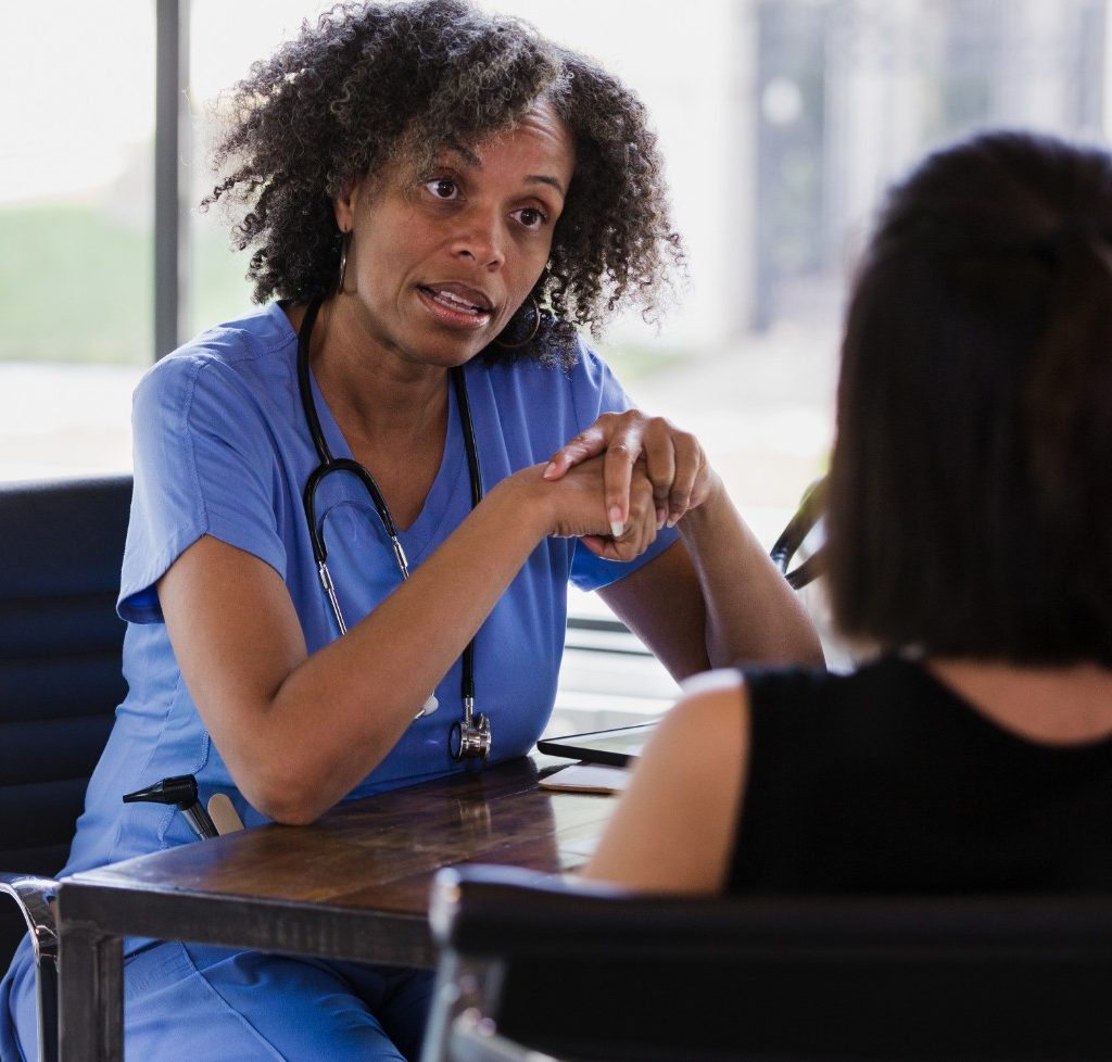 Obstetrician talking with a patient