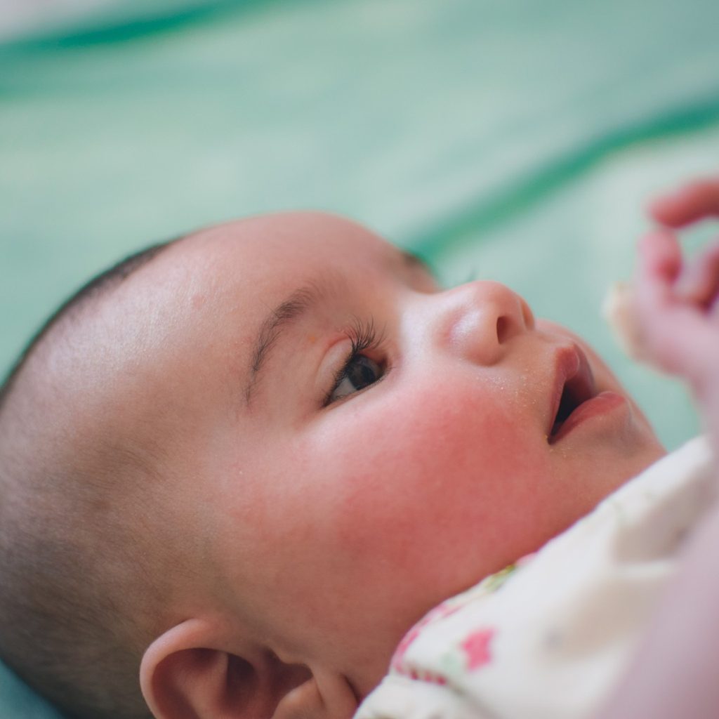 Baby lying in crib