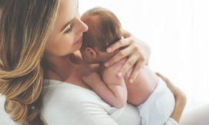 Mother holding infant baby
