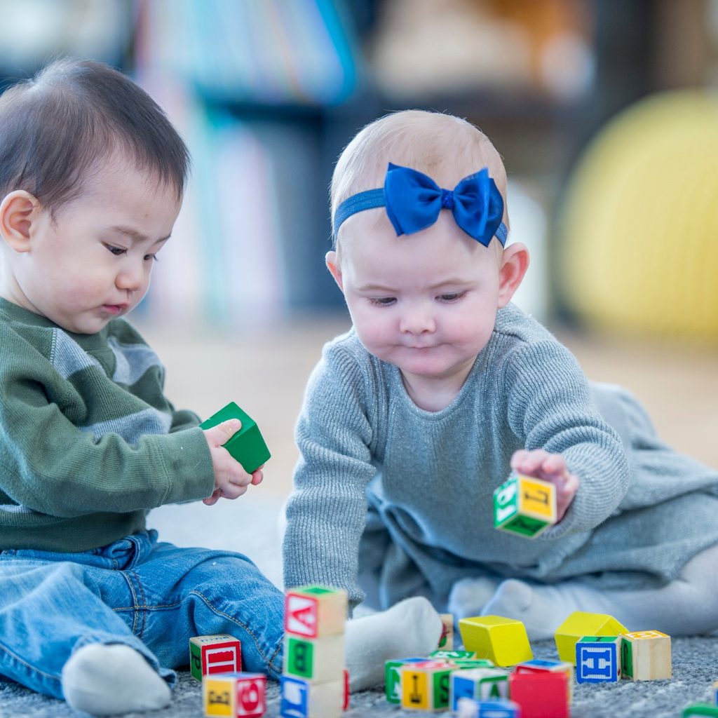 Boy and girl babies at day care