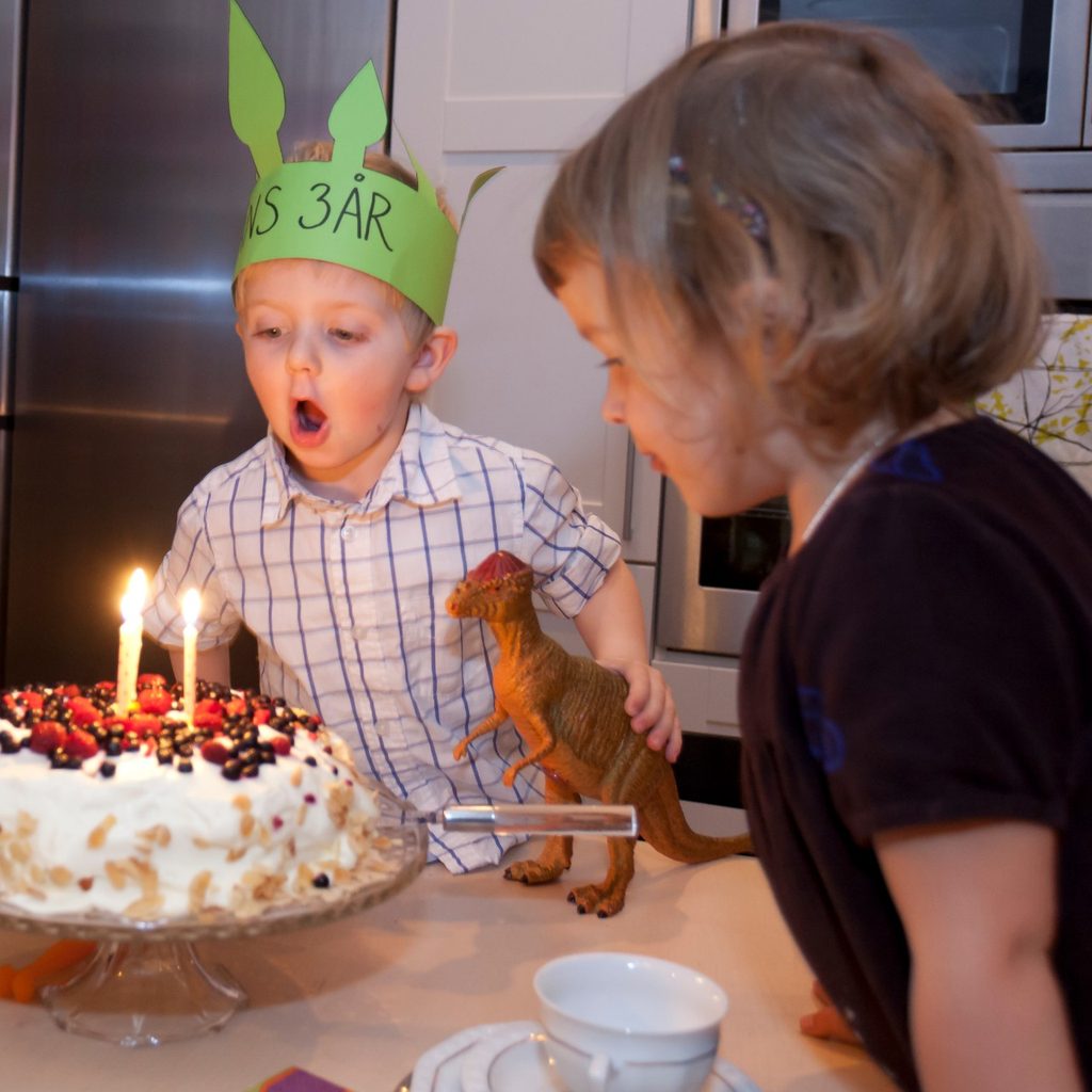 Boy with mother at birthday party