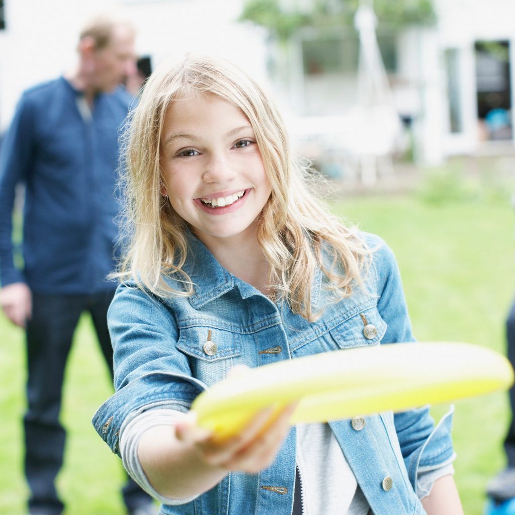 Little girl holding Frisbee