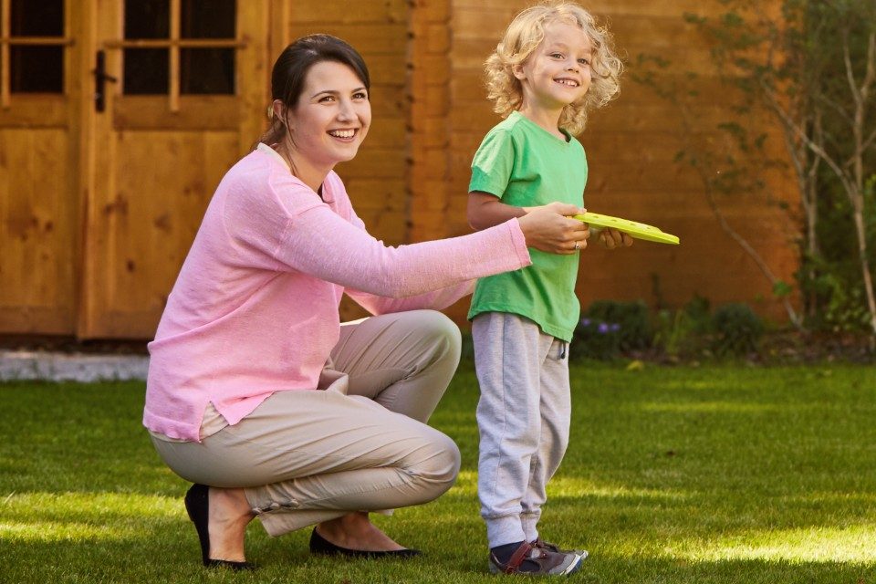 Mother with son holding a Frisbee