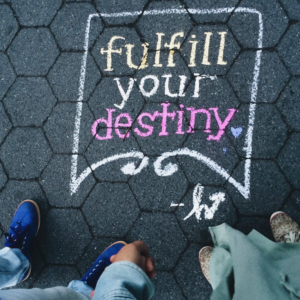 Sidewalk chalk art drawn by two children