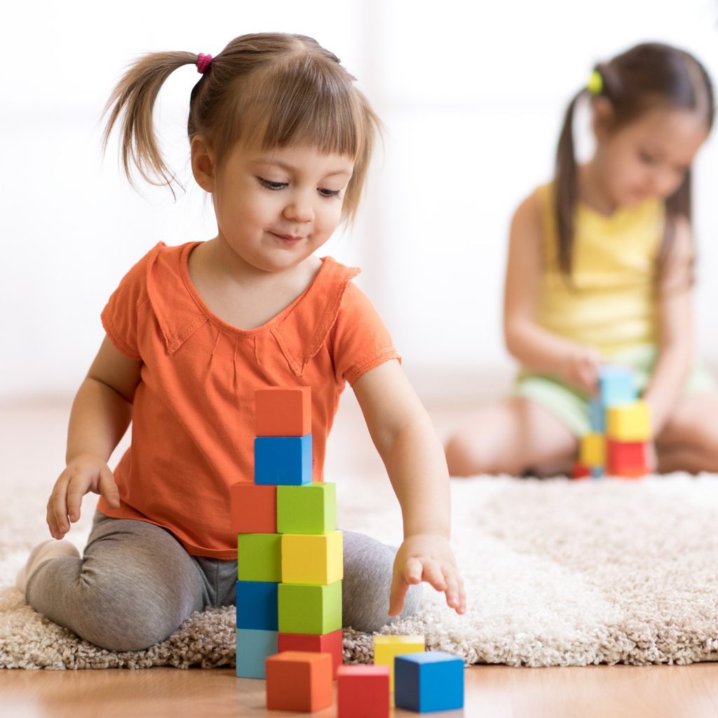 Toddler playing with shape sorter