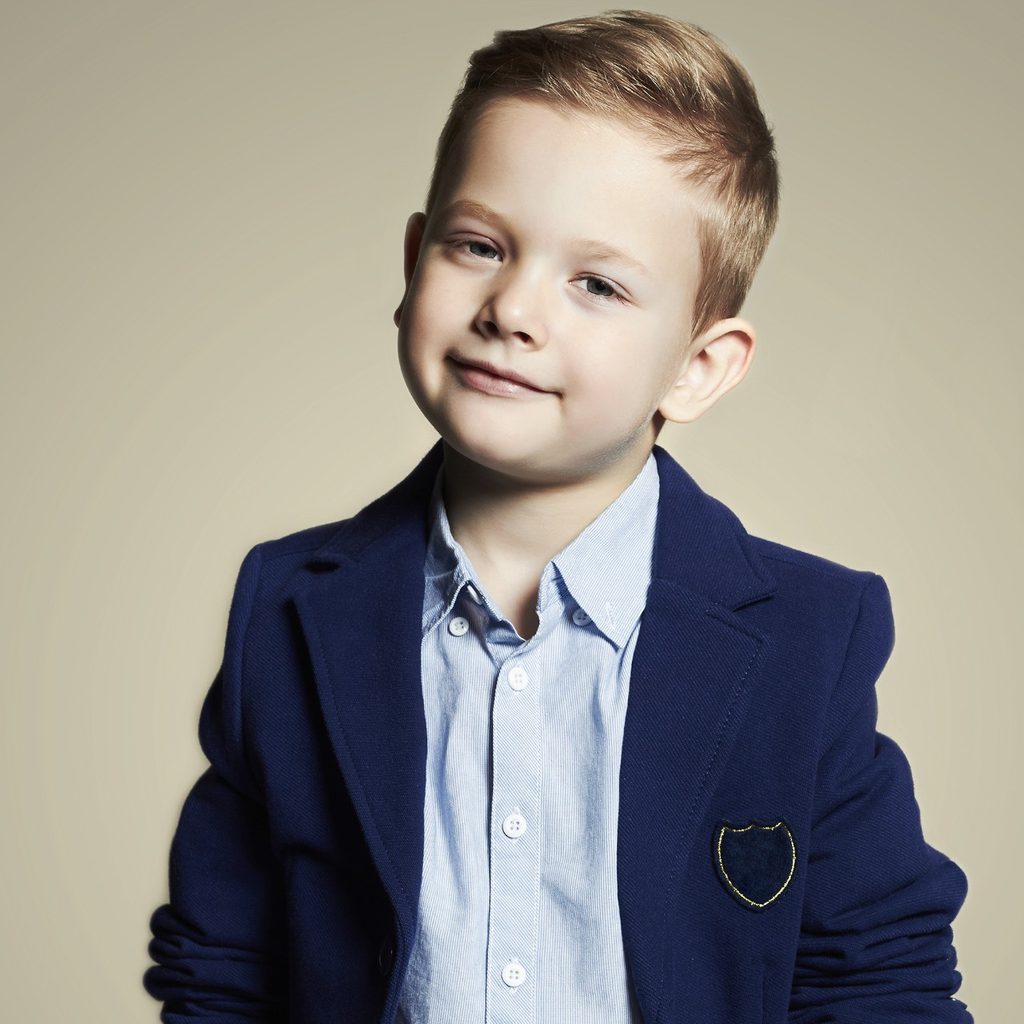 Young boy modeling fancy clothes