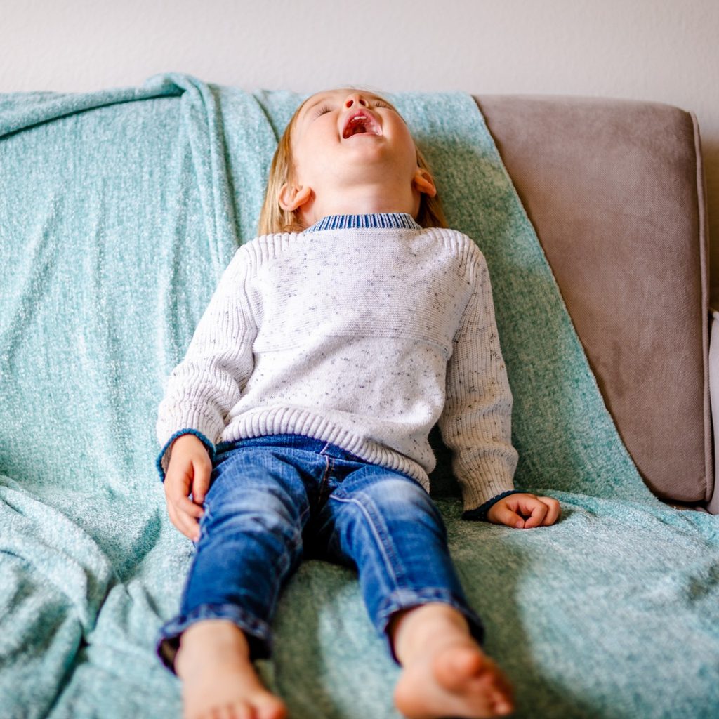 Toddler on couch having a tantrum