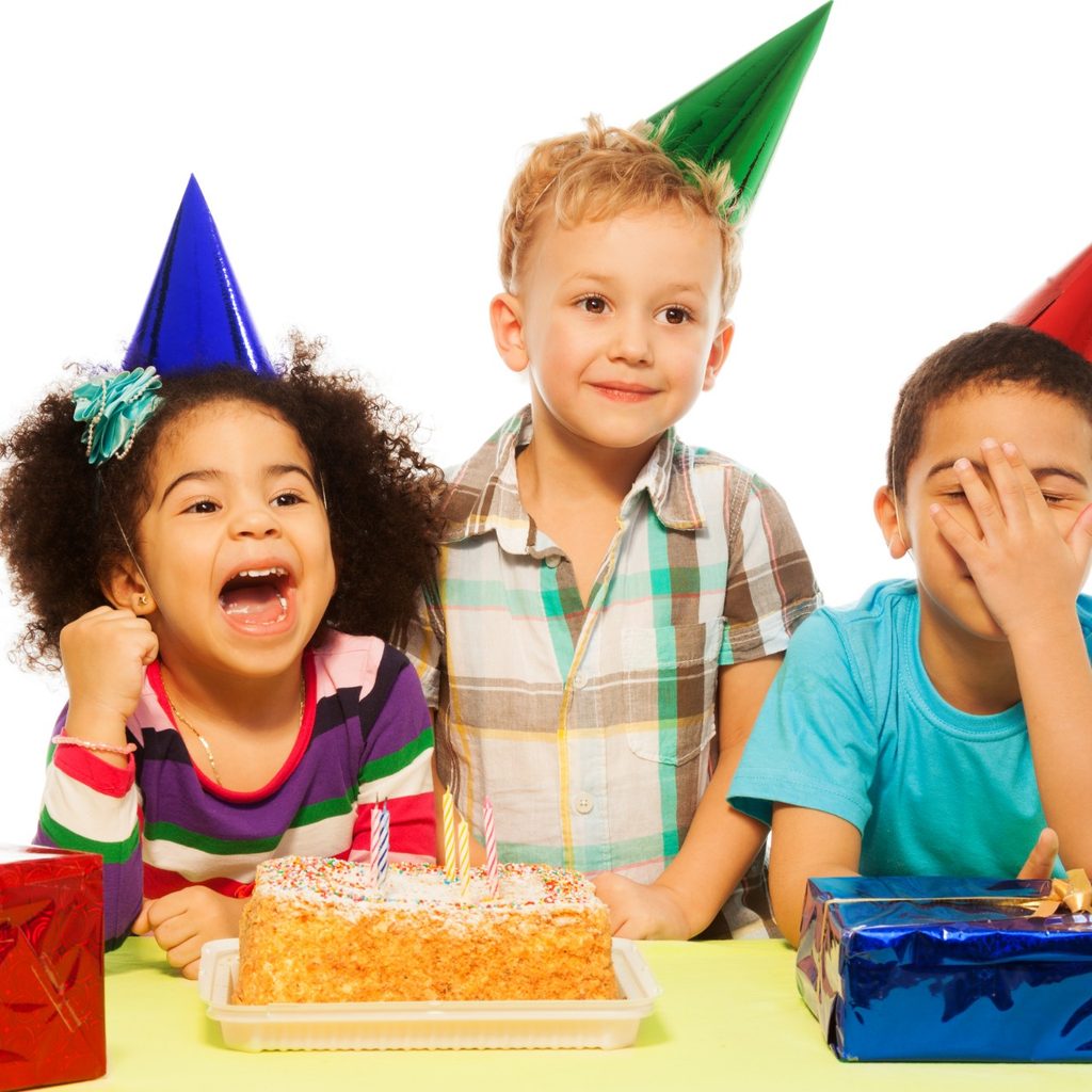 Three kids celebrating a birthday party