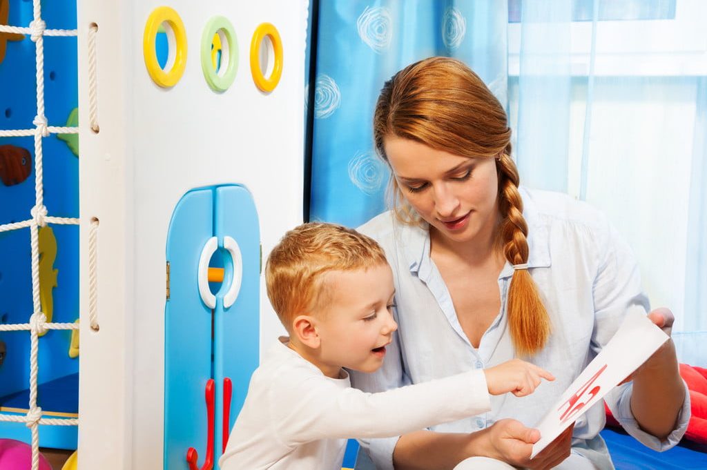 child looking at flash cards