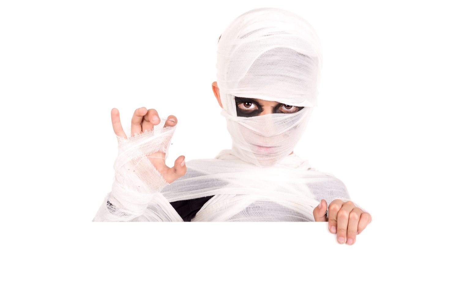 Boy wearing a mummy Halloween costume.