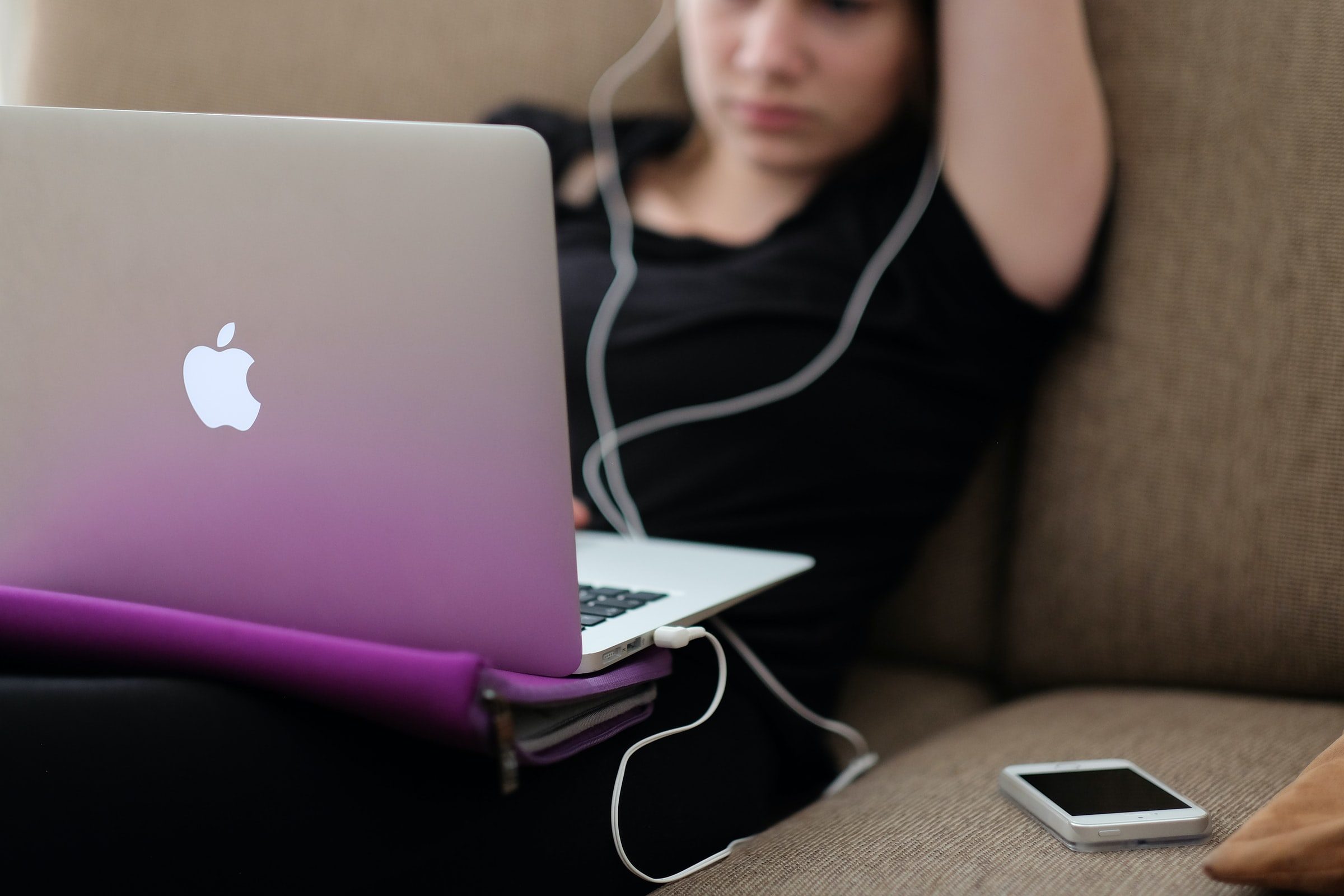 Teen on couch and laptop