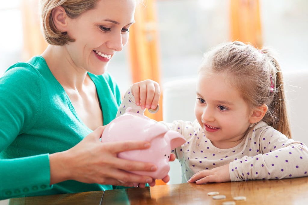 Parent and child with piggy bank