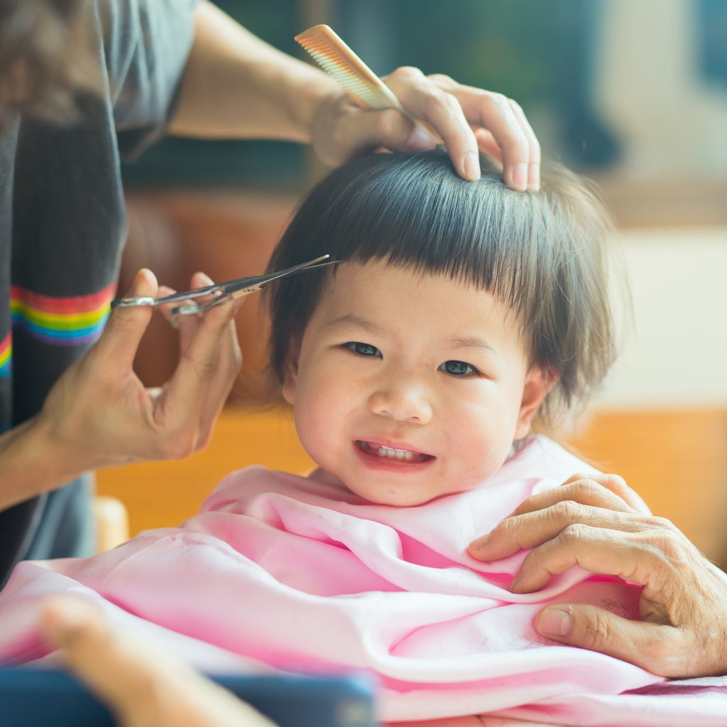 A child receiving a haircut.
