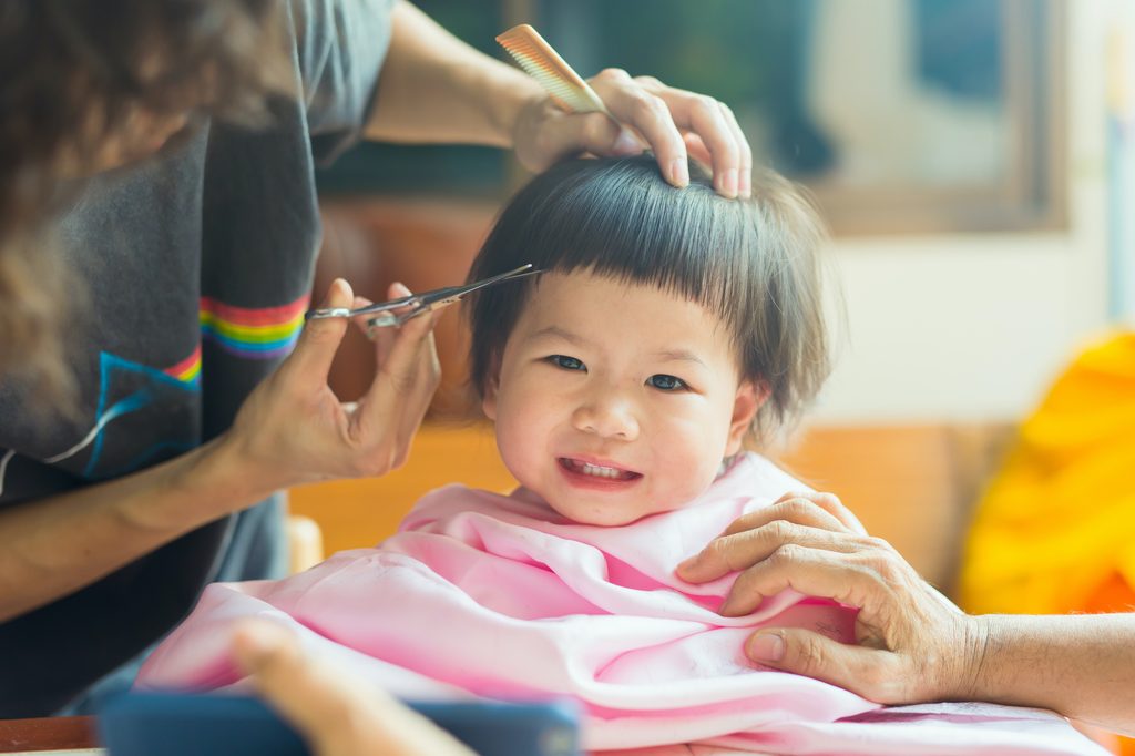 A child receiving a haircut.