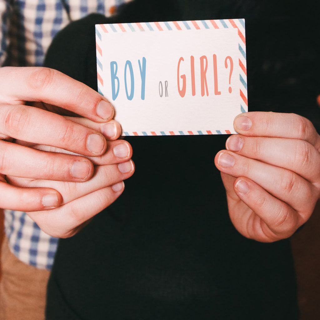 Couple holding boy or girl card