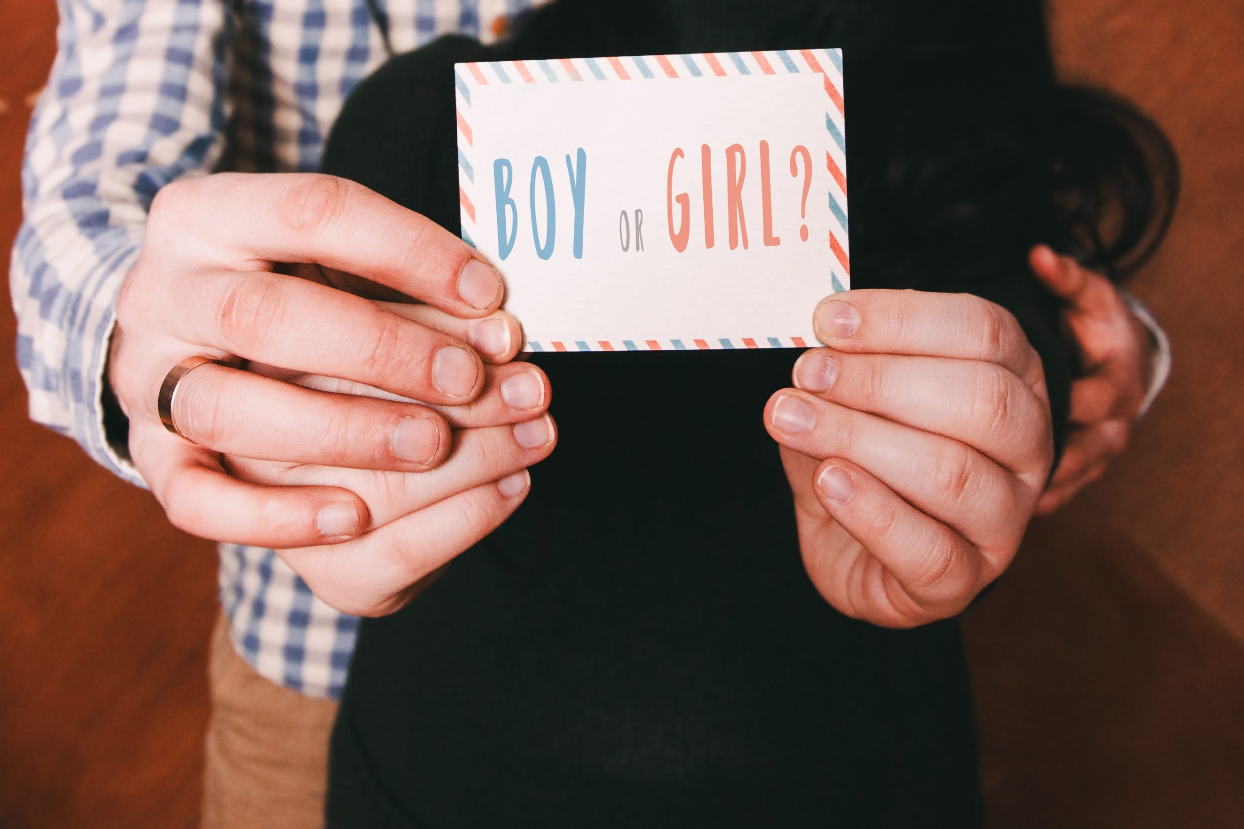 Couple holding boy or girl card