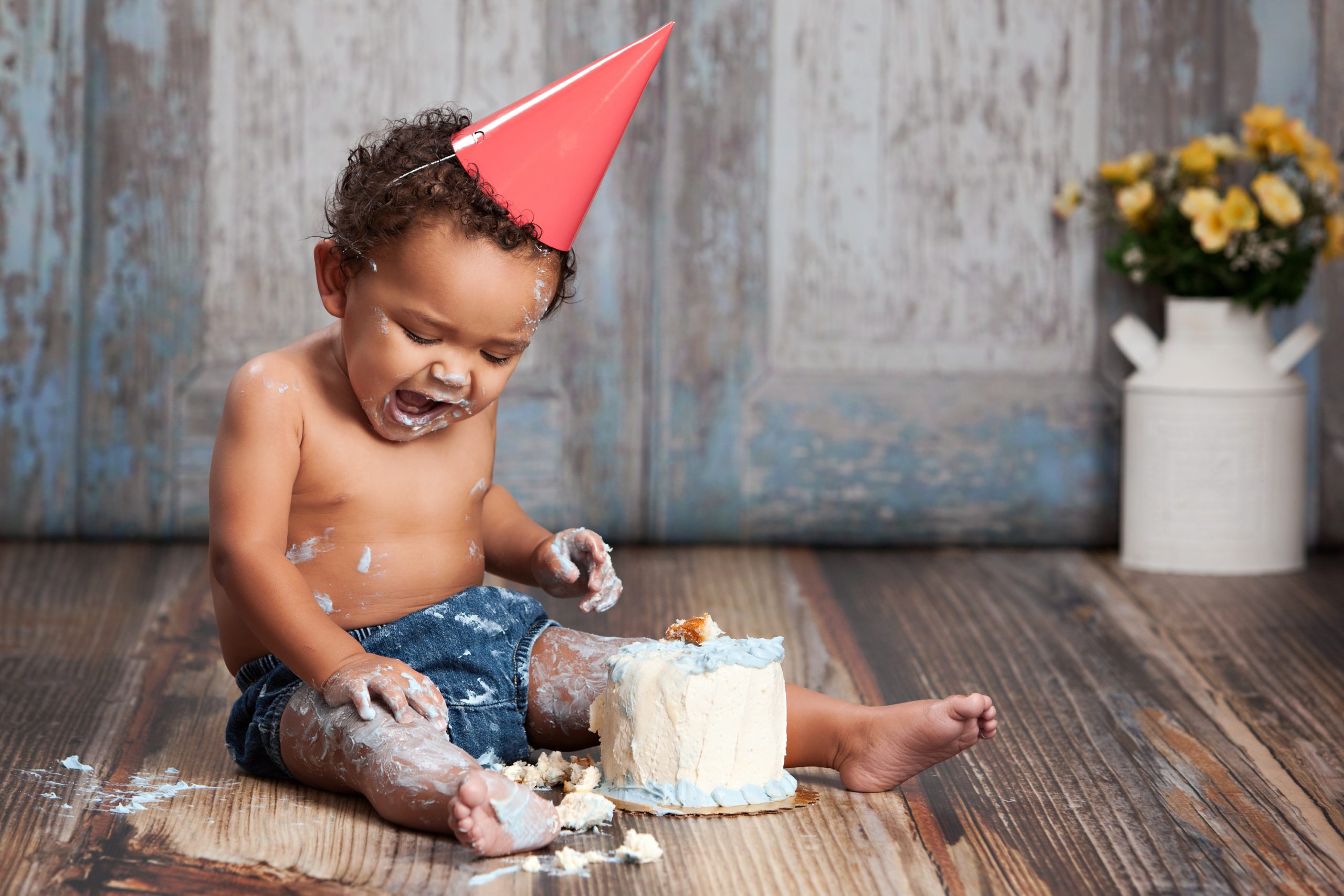 Baby boy enjoys birthday cake