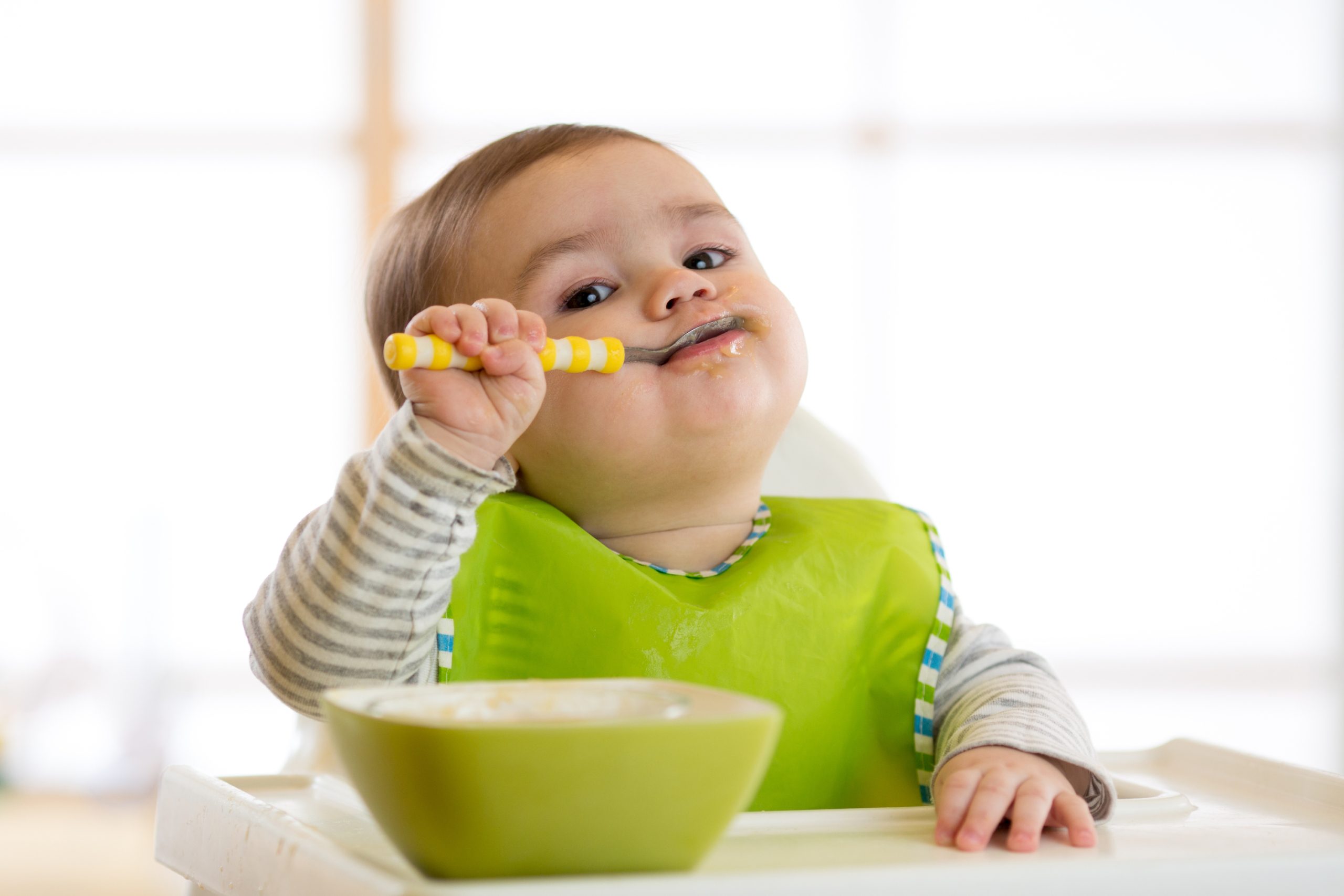 toddler eating fish
