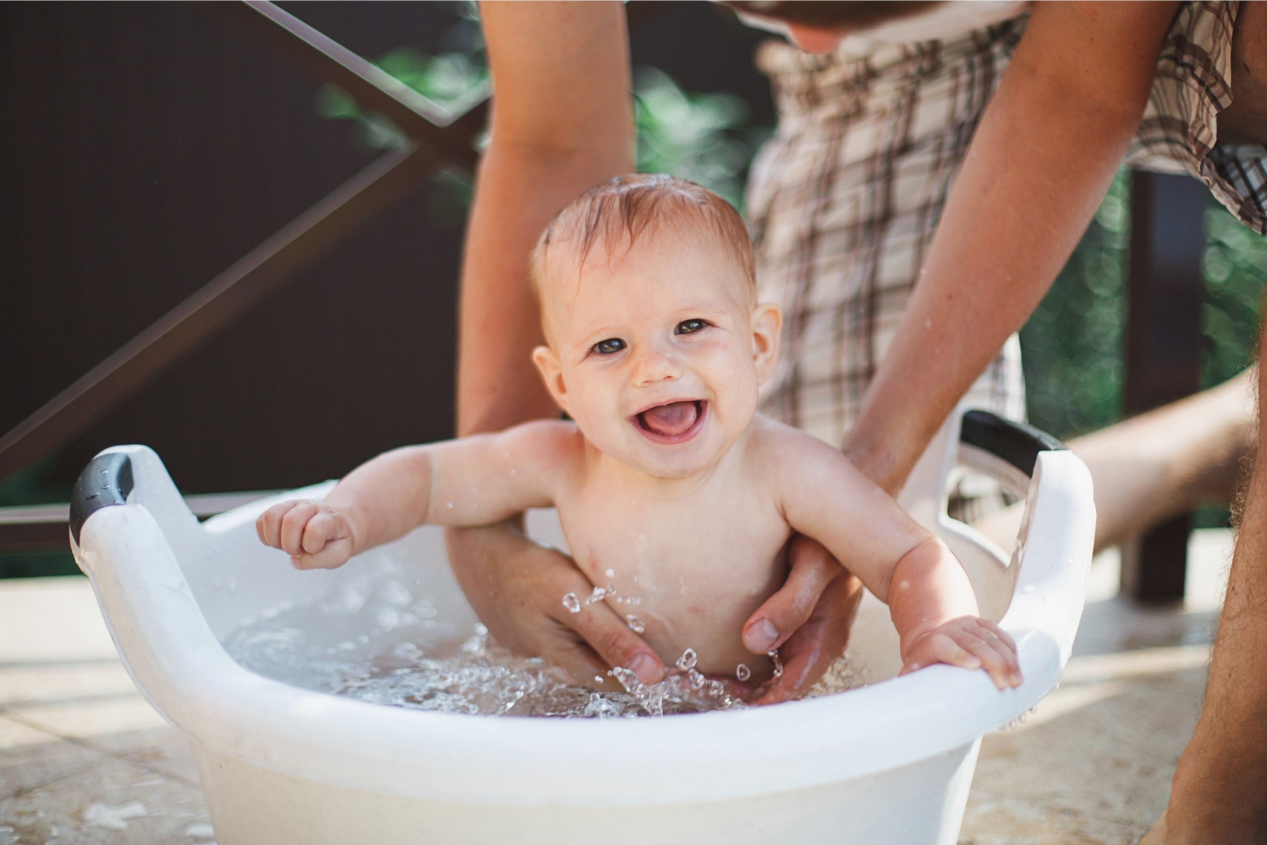 Baby laughing in bathtub