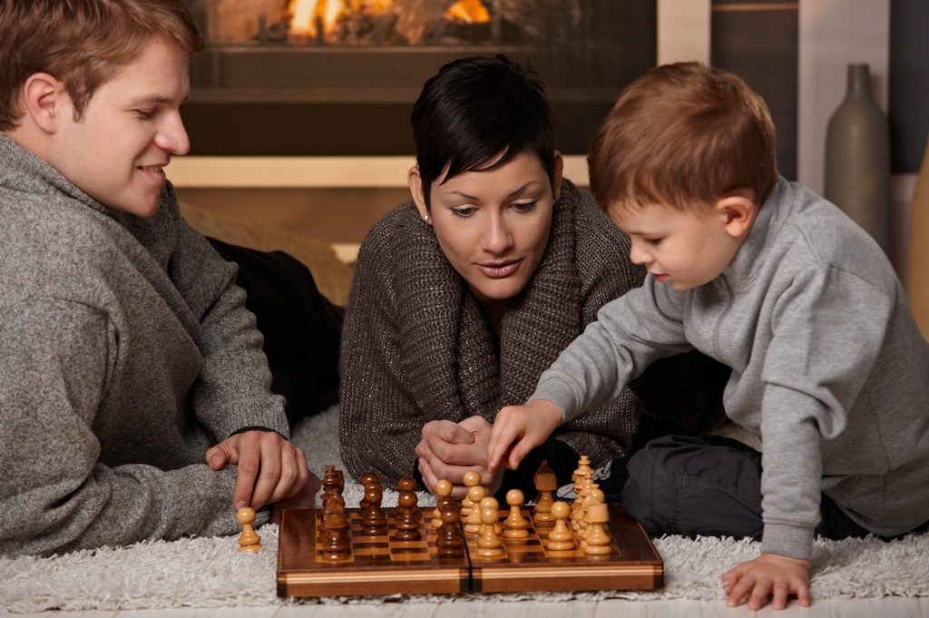 Family playing chess