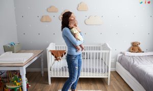 Mother comforting a crying baby.