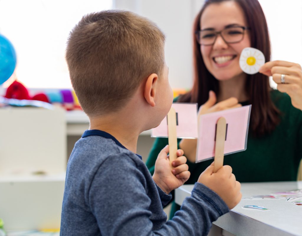 Child practicing speech therapy