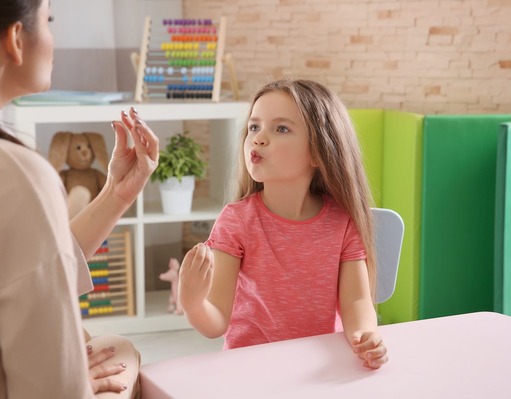 Parent and child practicing speech
