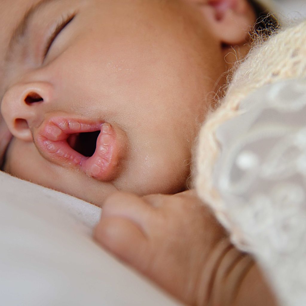 Baby sleeping with mouth open