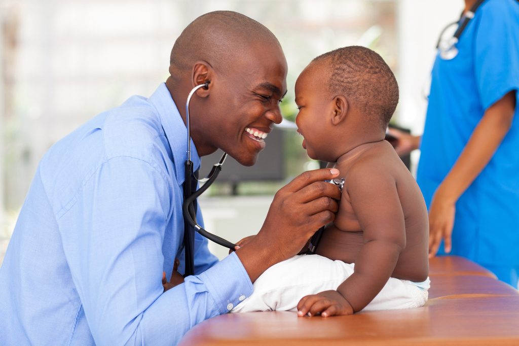 A doctor and baby at a checkup.