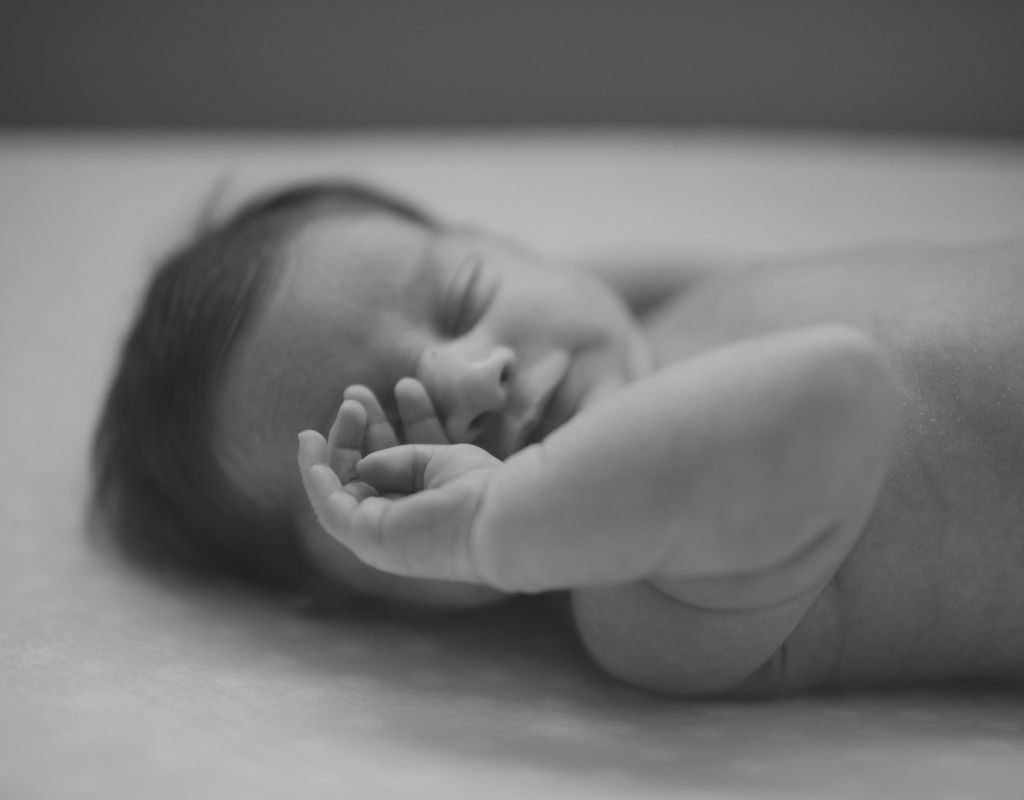 Baby sleeping on a sheet
