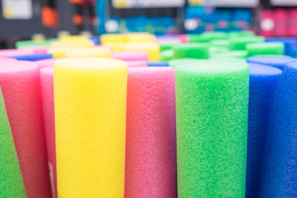 Rows of colored pool noodles