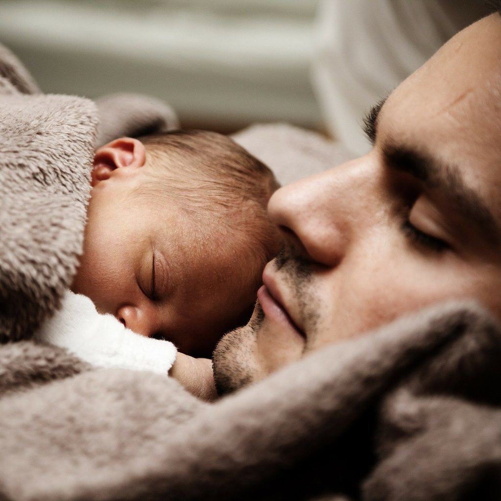 father sleeping with child