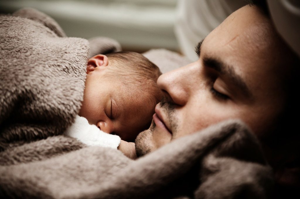 Father sleeping with child