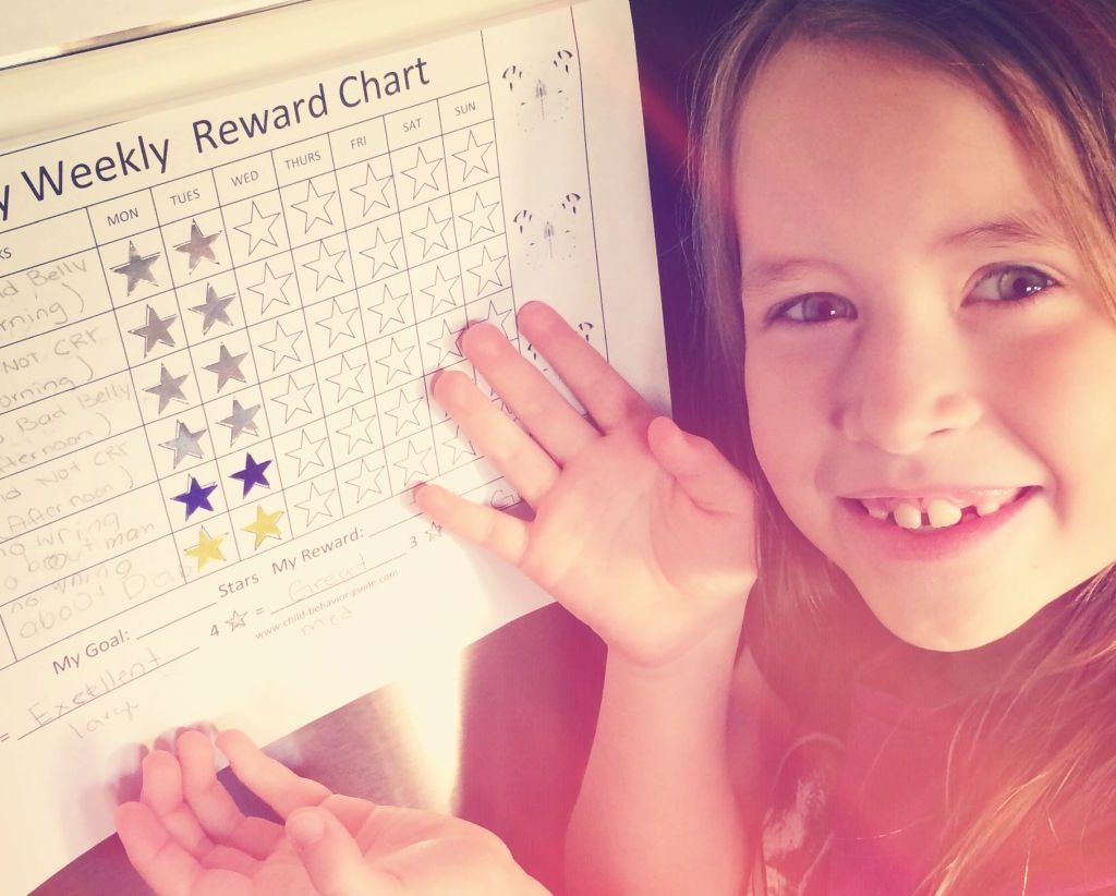 A girl with a chore chart