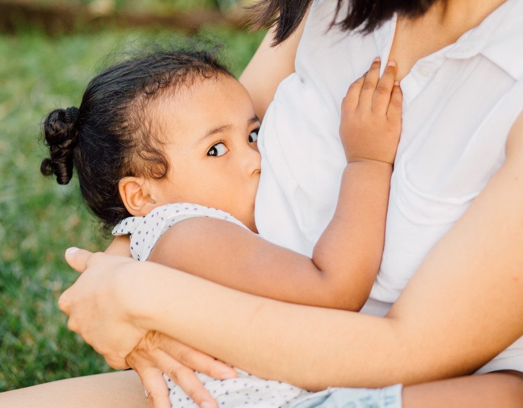 mom breastfeeding toddler