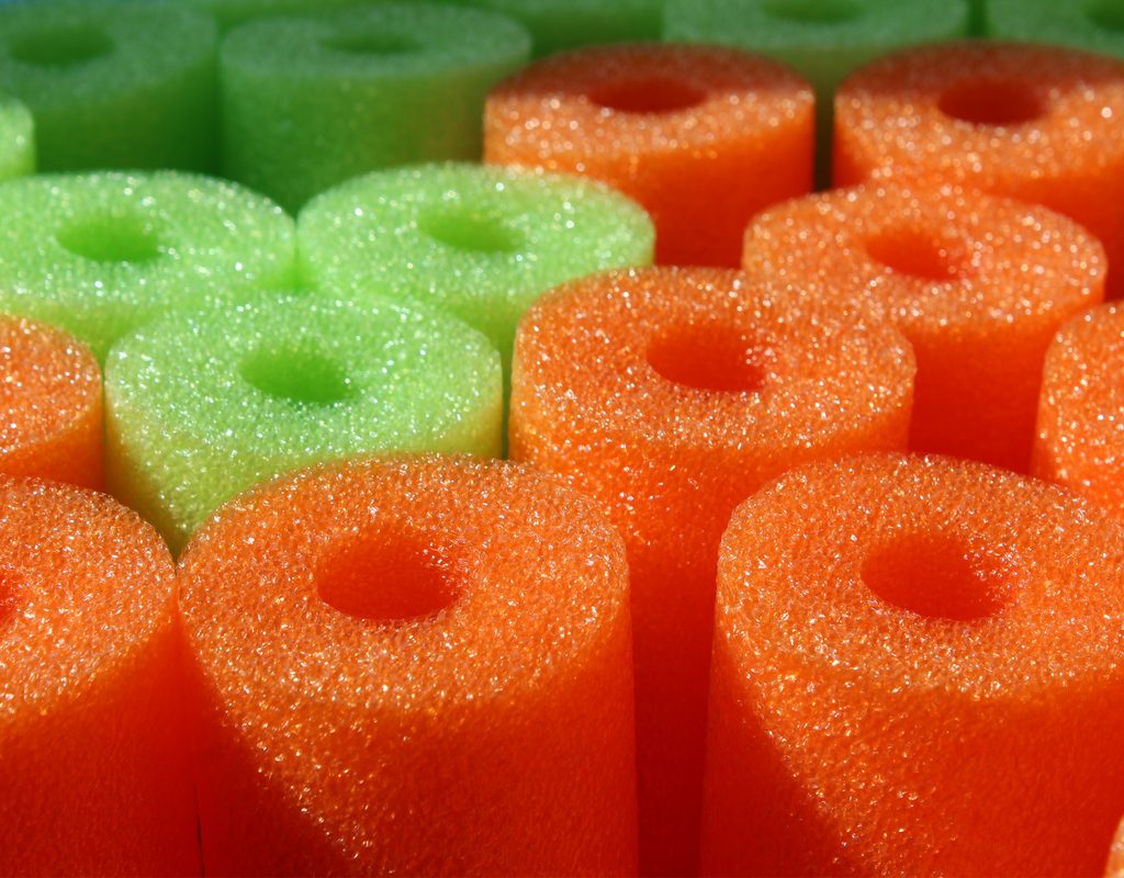 Green and orange pool noodles