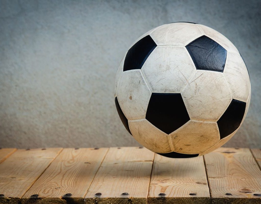 Soccer ball on a wooden shelf