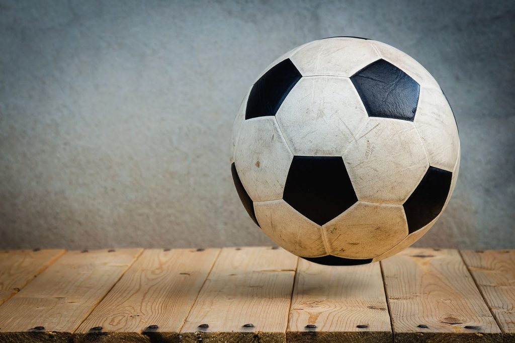 Soccer ball on a wooden shelf