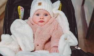 Baby in a seat bundled up for winter cold